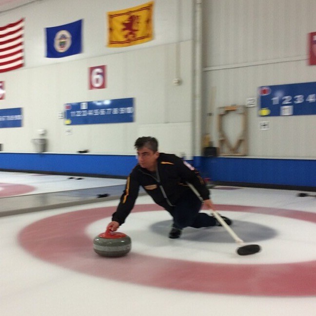 Mary sliding out of the hack at the curling club